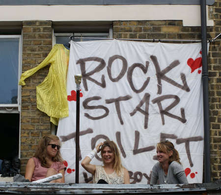 London, England - 30 August 2010 - Women watching the parade at the Notting Hill Carnivalのeditorial素材