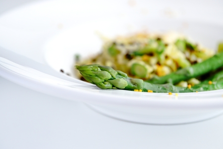 Green Asparagus Risotto with Beluga Lentils and Orange Sauce Hollandaiseの写真素材