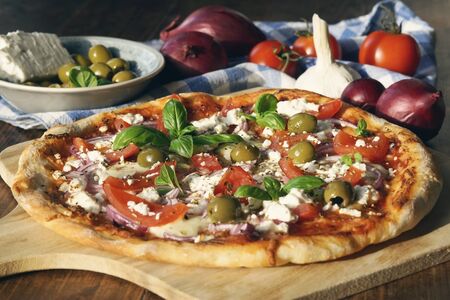 Homemade Greek Pizza with Feta Cheese and Green Olivesの写真素材