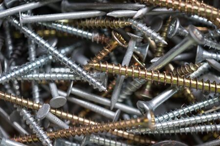 Nails and screws background. Construction hardwareの写真素材
