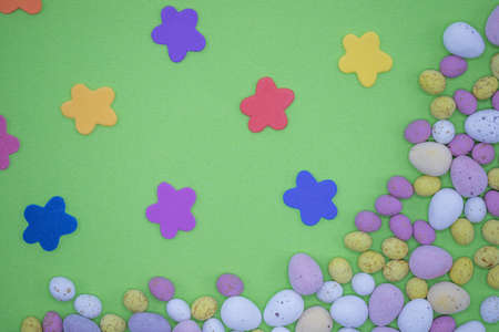 Chocolate Easter eggs on a colourful background. Springtime treatsの写真素材