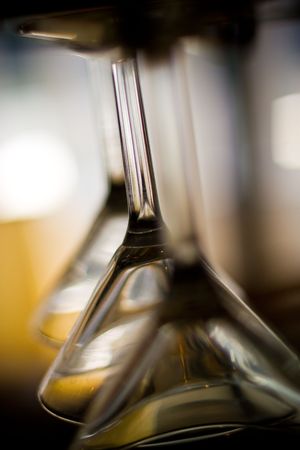 Three martini glasses hanging upside downの写真素材