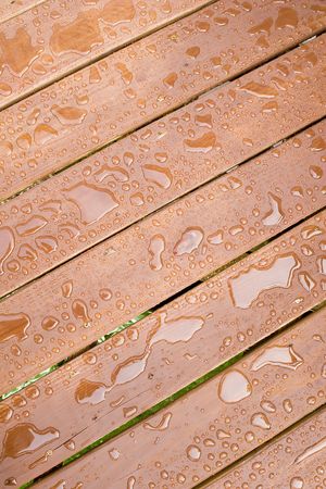 Rain Drops on a sealed wooden surfaceの写真素材