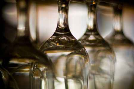 Empty wine glasses hanging upside down
