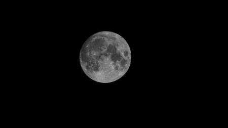 Full Earth's Moon glow on black background. Image in high resolution. Bright lunar satelliteの写真素材