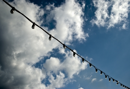 Light bulbs against skyの写真素材
