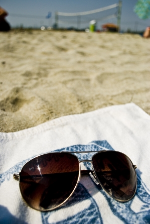 Sunglasses on towelの写真素材