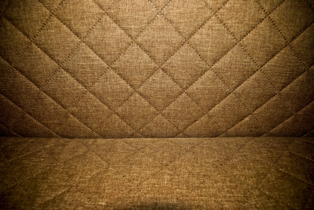 Dark brown quilted hupholstery background or textureの写真素材