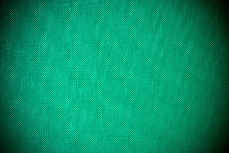Grunge green grained synthetic material background or textureの写真素材