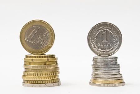 Stack of money euro and zloty coins  Currency rate comparison conceptの写真素材