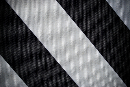 White and blue grained woven synthetic material background or texture