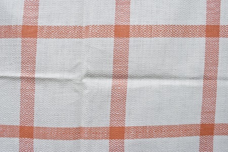 White and red checked fabric background or texture