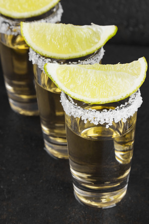 Tequila with salt and lime on a dark backgroundの写真素材