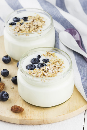 Yogurt with blueberry on a white background.の写真素材