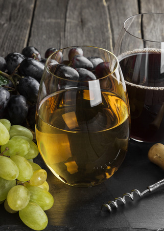 Red and white wine against a dark backgroundの写真素材