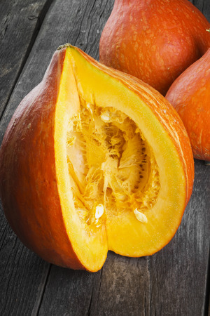 Pumpkin slice on wooden a backgroundの写真素材