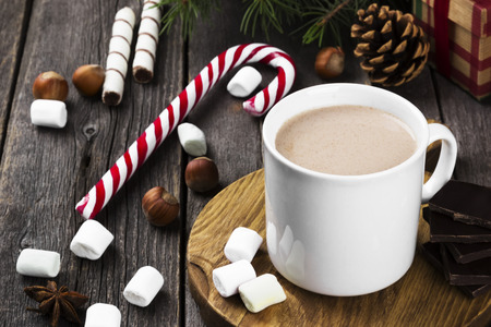 Christmas drink hot chocolate with marshmallows on a wooden background. Copy space. Food backgroundの写真素材