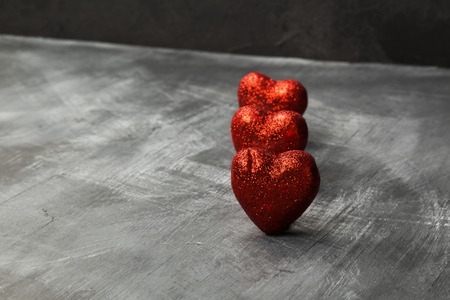 Red heart on a dark background. Copy spaceの写真素材