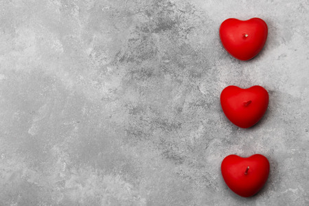 Candles in form of heart on a light background. Top view, copy spaceの写真素材