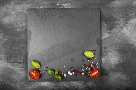 Various spices, herbs and vegetables on dark background. Top view, copy space. Food backgroundの写真素材