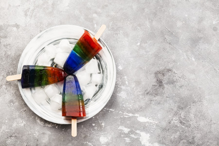 Rainbow ice cream on a gray background. Top view, copy space. Food backgroundの写真素材