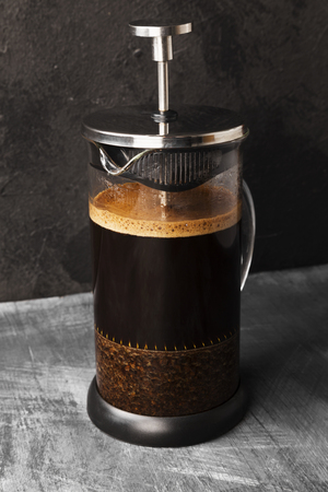 Coffee in french press on dark backgroundの写真素材