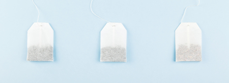 Tea bags on blue background. Top view. Food backgroundの写真素材
