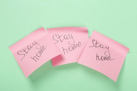 Concept of self-isolation and quarantine. Stay at home. Stickers with text on green background