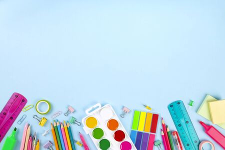 Various school office and painting supplies on blueの写真素材