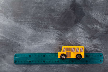 Back to school concept. Imitation of trip to school on school bus. Top view. Copy spaceの写真素材