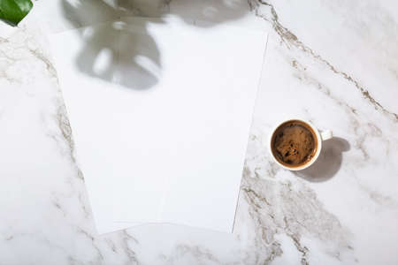 Mockup menu restaurant or coffee shop three narrow pages, coffee mug, shadow from plantsの写真素材