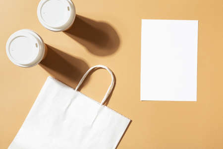Mockup menu and coffee shop paper bag, coffee cupsの写真素材