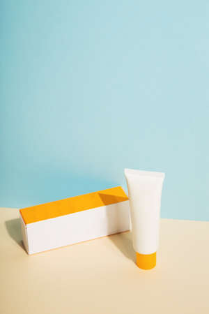 White tube and box of sunscreenの写真素材