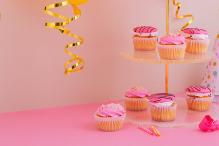 Preparing for a birthday party. Attributes of holiday on pink backgroundの写真素材