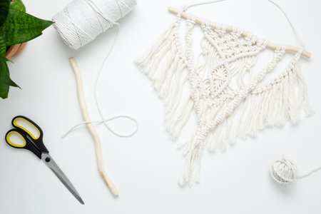 Creative hobby handmade macrame for home decoration. Weaving macrame at home. Tools and materials...