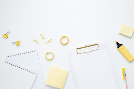 Mockup notebooks and set of stationery for work and study on white background. back to school. Top view, flat lay, copy spaceの写真素材