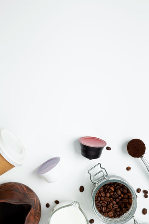 Ingredients for making coffee. Making coffee in clay cezve with milk or coffee machine capsules. Coffee making concept. Flat Lay. Top view. Copy spaceの写真素材