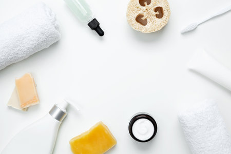 Natural organic eco cosmetics. Soap Eco, reusable cotton pads, loofah natural sponge washcloth, cotton swab, eucalyptus leaves, towel on white background. Flat lay, top view, copy spaceの写真素材