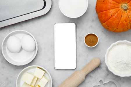 Ingredients for baking cookies for Halloween, smartphone mock-up. Seasonal autumn bakingの写真素材