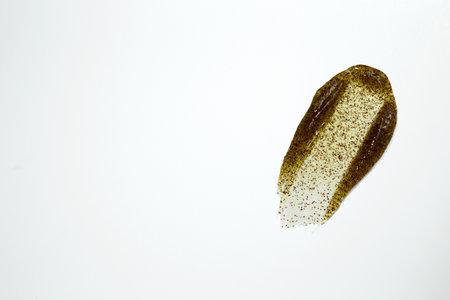 Smears of body scrub on white background. Fruit and berry body scrub texture of the swatch. Cosmetic smileの写真素材