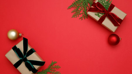 Christmas ornaments, gifts wrapped in craft paper, thuja branchesの写真素材