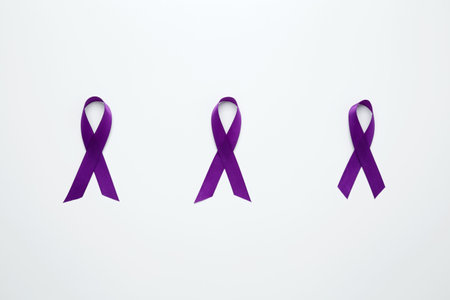 Purple Epilepsy Awareness Day, purple ribbon held, symbol of supportの写真素材