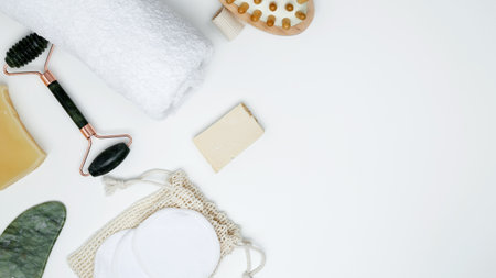 Sustainable self-care concept. Eco-friendly beauty products: massage brush, marble roller, towel, reusable cotton padsの写真素材