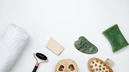 Sustainable self-care concept. Eco-friendly beauty products: massage brush, marble roller, towel, reusable cotton padsの写真素材