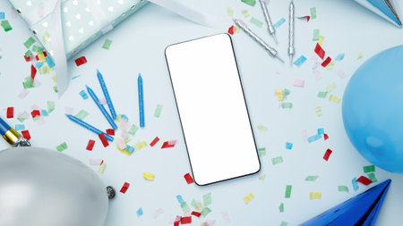 Concept of celebration and technology. Smartphone with blank screen surrounded by balloons, gifts, and party decorationsの写真素材