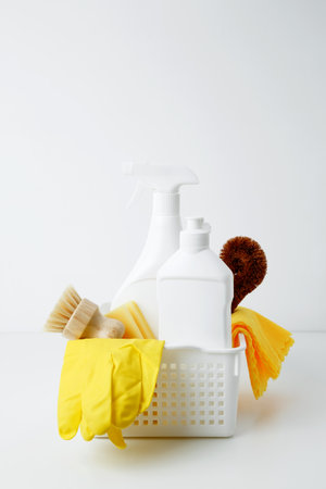 Cleaning supplies in a container, ready for a productive and satisfying spring refresh. Household cleaning and hygiene concept conceptの写真素材