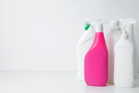 Various cleaning supplies on white background symbolizing spring cleaning. Household cleaning and hygiene concept conceptの写真素材