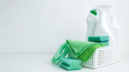 Household cleaning and hygiene concept. Cleaning supplies in a container, ready for a productive and...