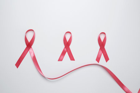 Pink ribbon symbolizing breast cancer awareness and prevention