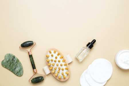 Skincare set with marble roller, gua sha, wooden body brush, facial cream and serum for natural beauty careの写真素材